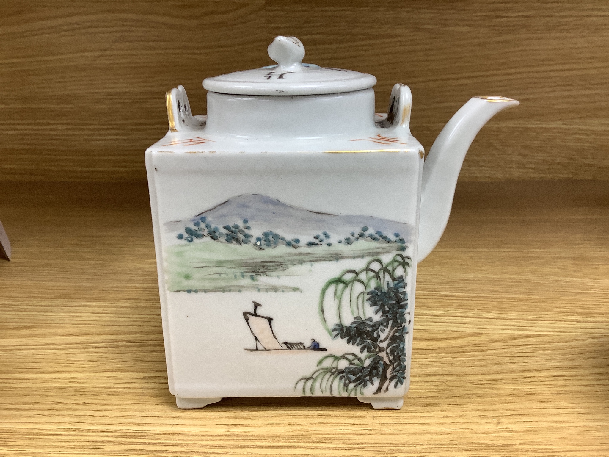 A Chinese enamelled porcelain square teapot and cover and a similar miniature teapot and cover, tallest 13cm